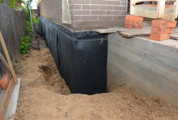 Happy homeowners after waterproofing job in Rawson